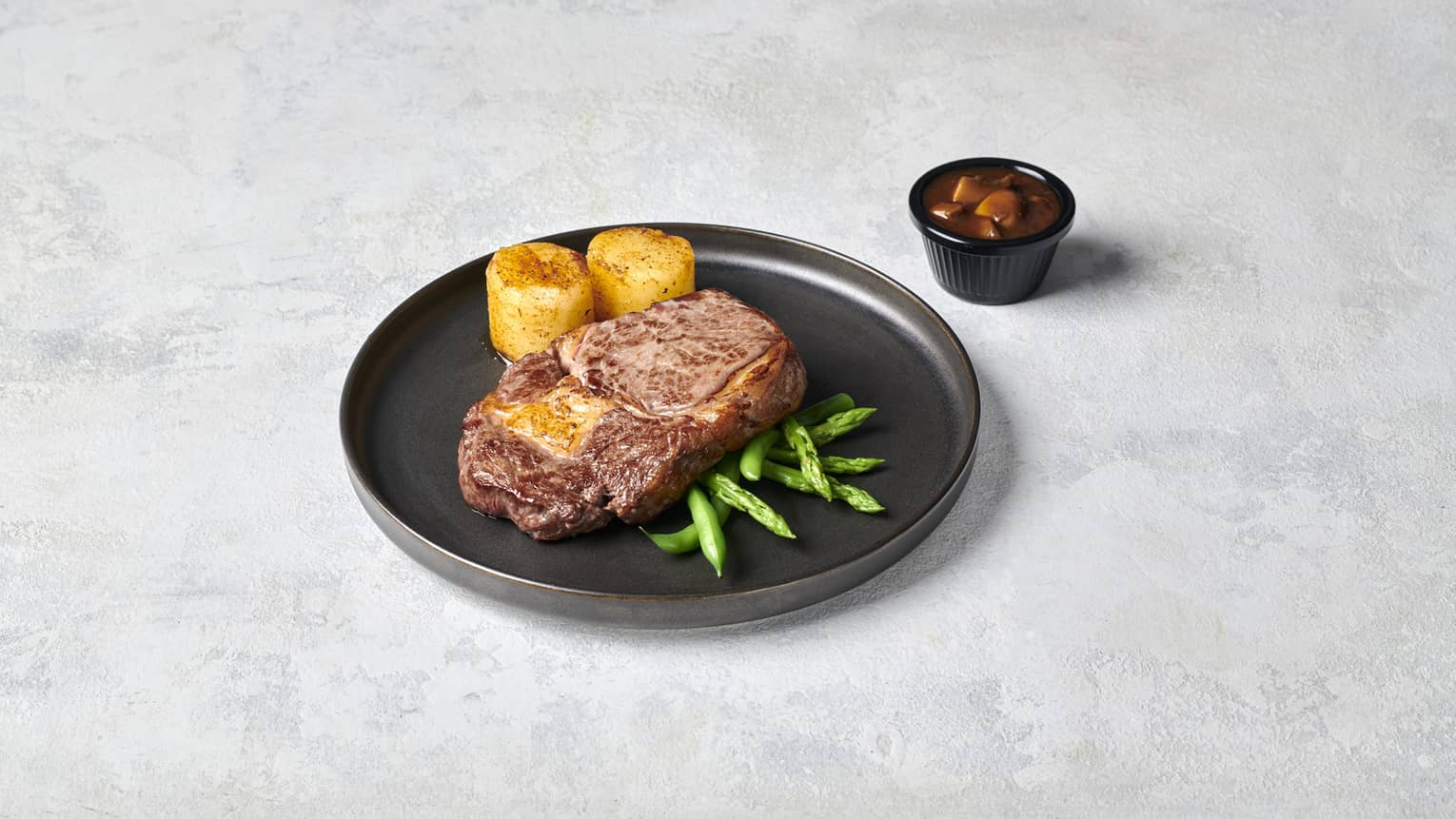 Ribeye with Seasonal Greens, Crispy Potato Fondant and Mushroom Sauce