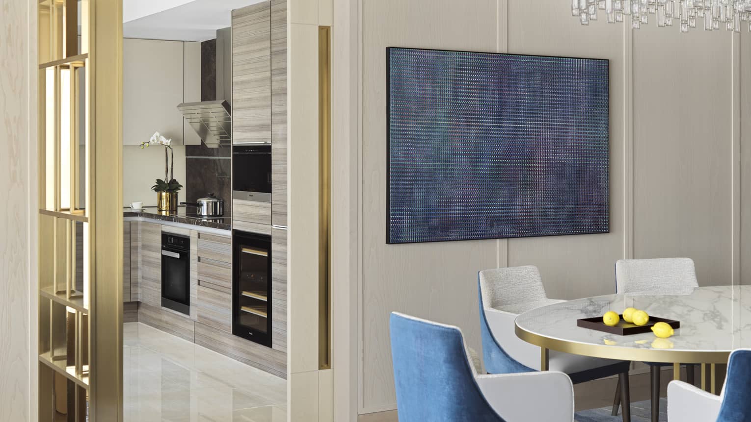 Luxury hotel suite dining room and kitchen at The Grand Suites at Four Seasons, Macao