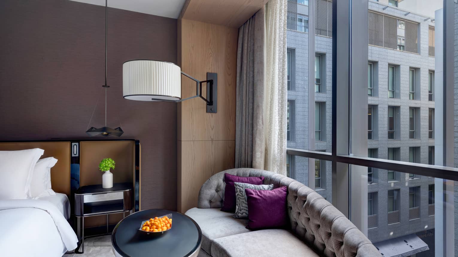 Bedroom with chaise lounge against the window