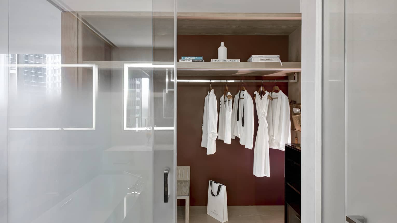 Bathroom opening to a closet