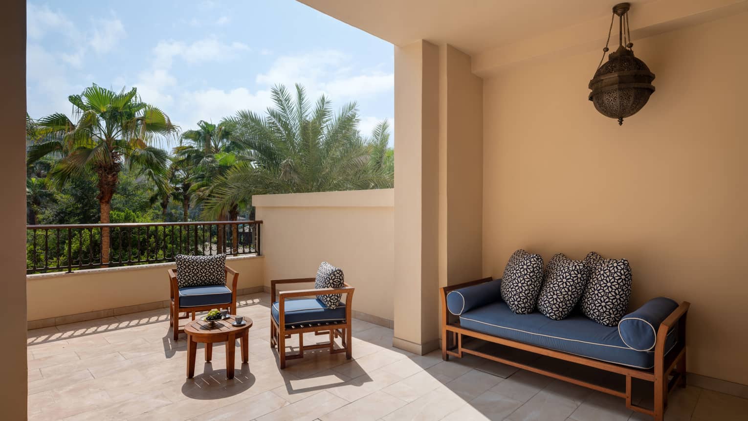 Spacious private terrace with bench, two arm chairs and small table