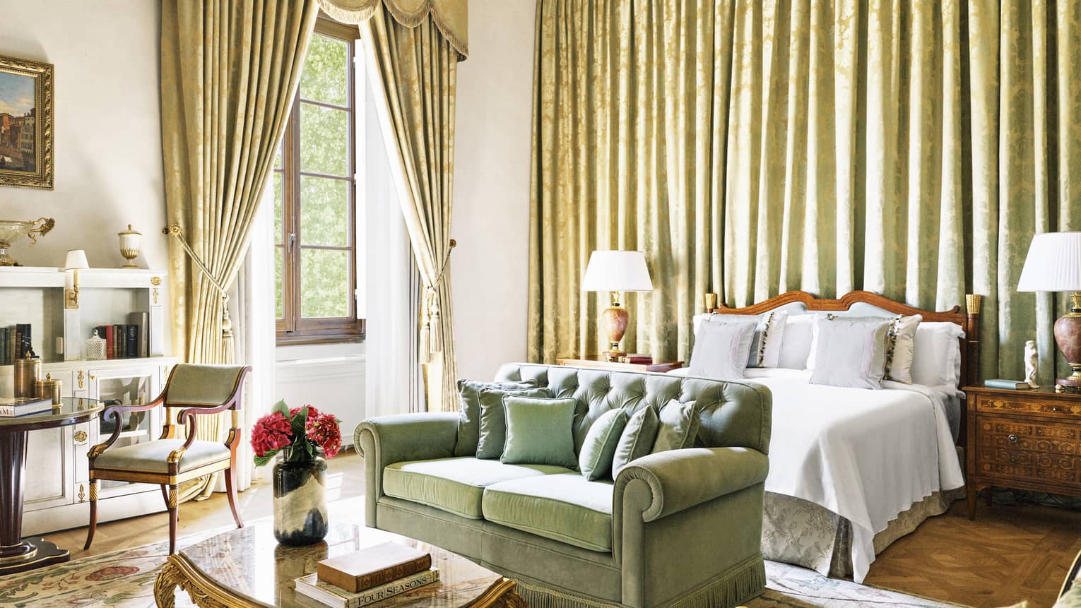 Renaissance Suite bedroom with curtained wall, king bed, sitting area and window at Four Seasons Hotel Florence