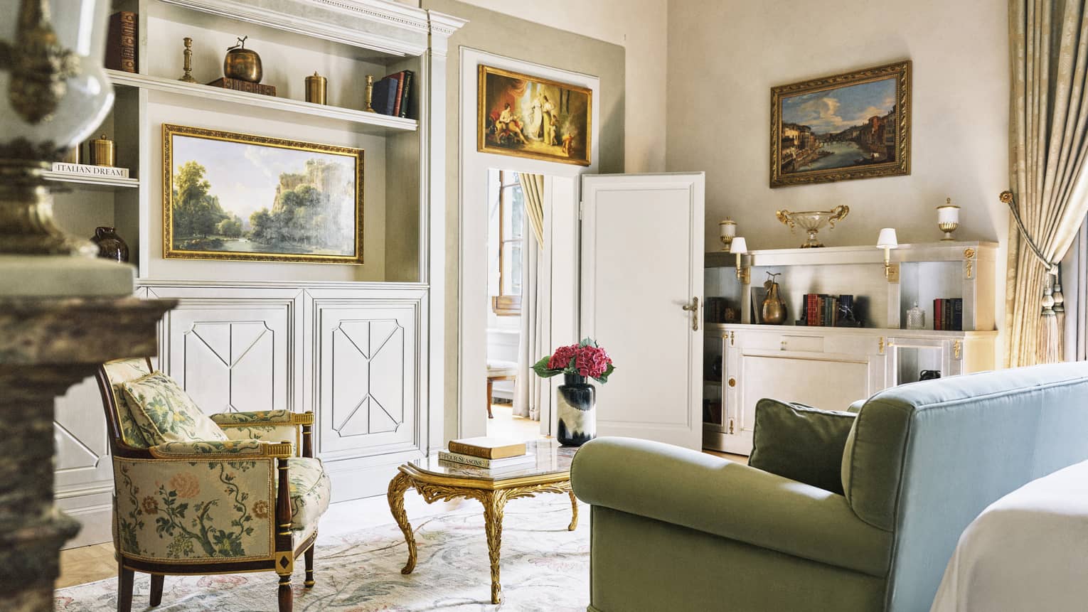 Renaissance Suite living room with sage sofa, arm chair and coffee table, at Four Seasons Hotel Florence