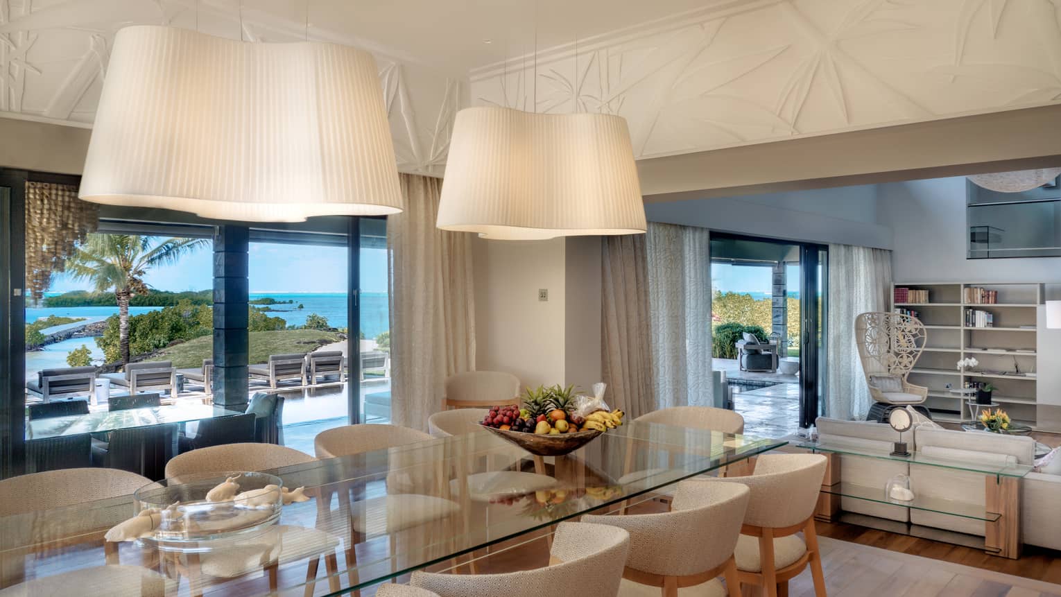 A contemporary kitchen table with ample seating set against incredible ocean views