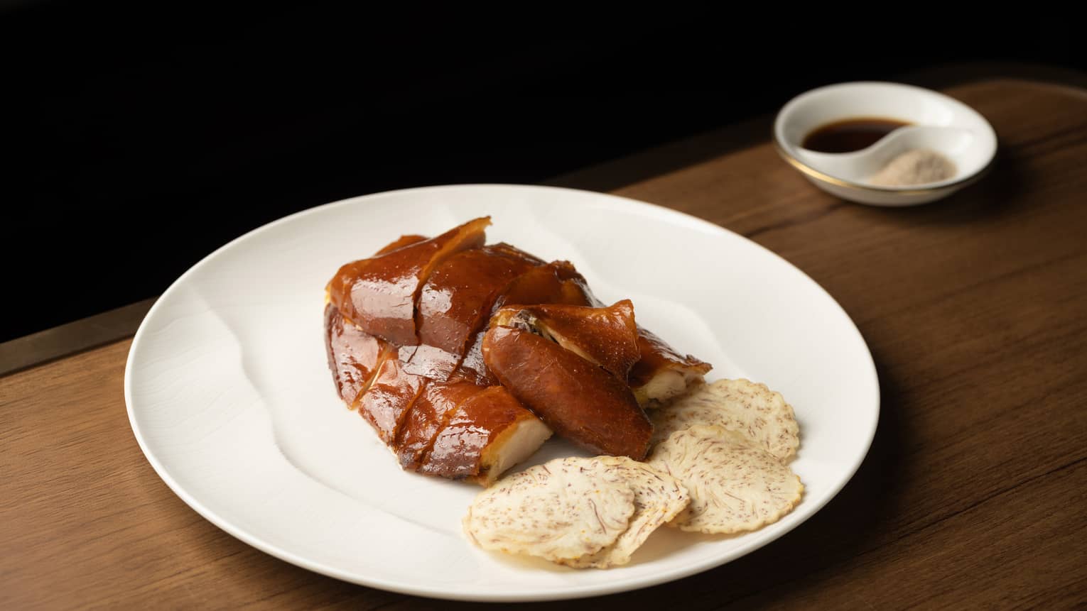 Crispy chicken dish on white plate