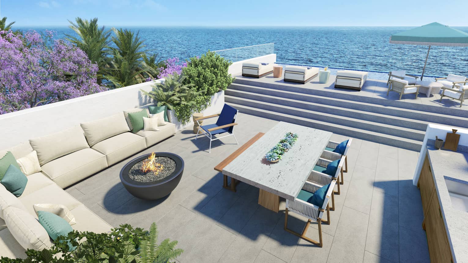 Outdoor kitchen and dining area with a lounging platform overlooking the ocean