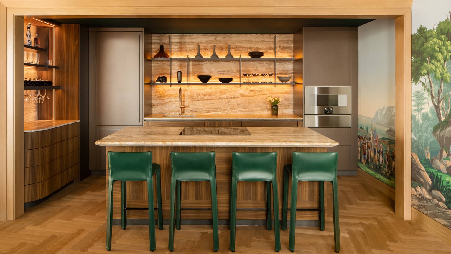 Residential kitchen with island and four green high-top chairs