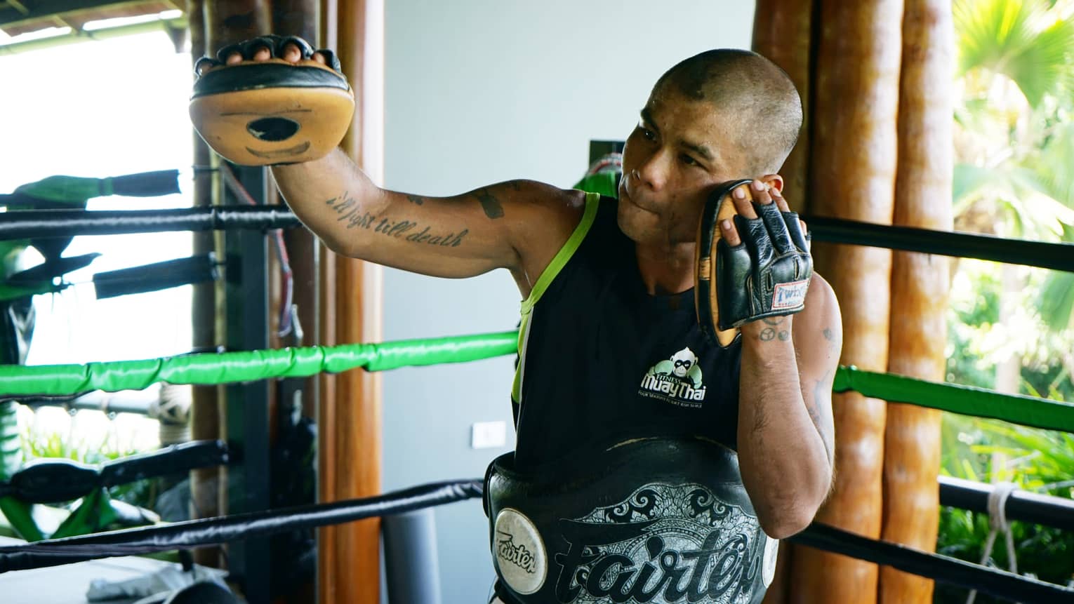 Resident Muay Thai expert, Anuphong Deesamer, leading a sparring session