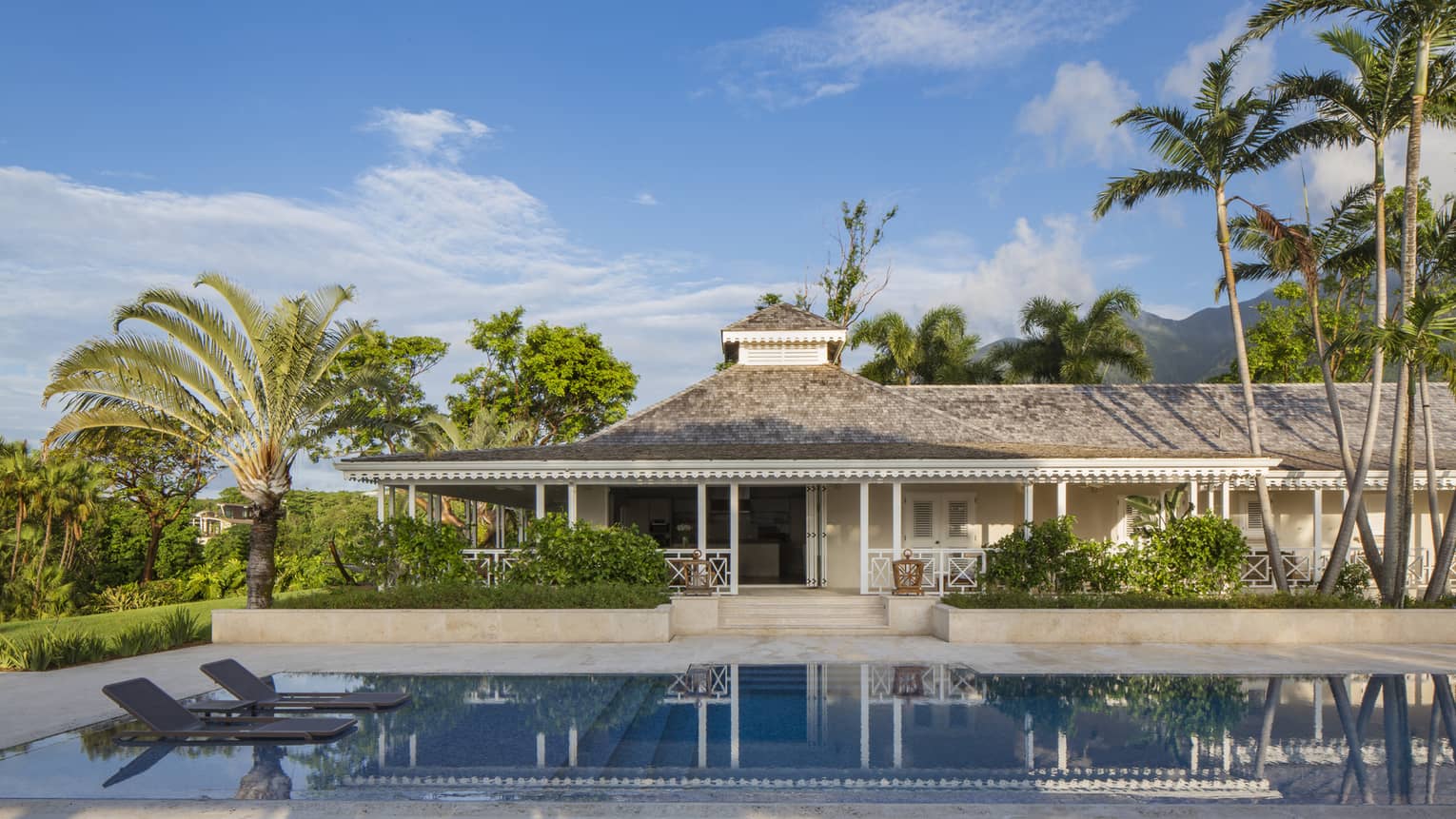 Large, private plunge swimming pool, floating lounge chairs outside Palm Grove Residence Villa