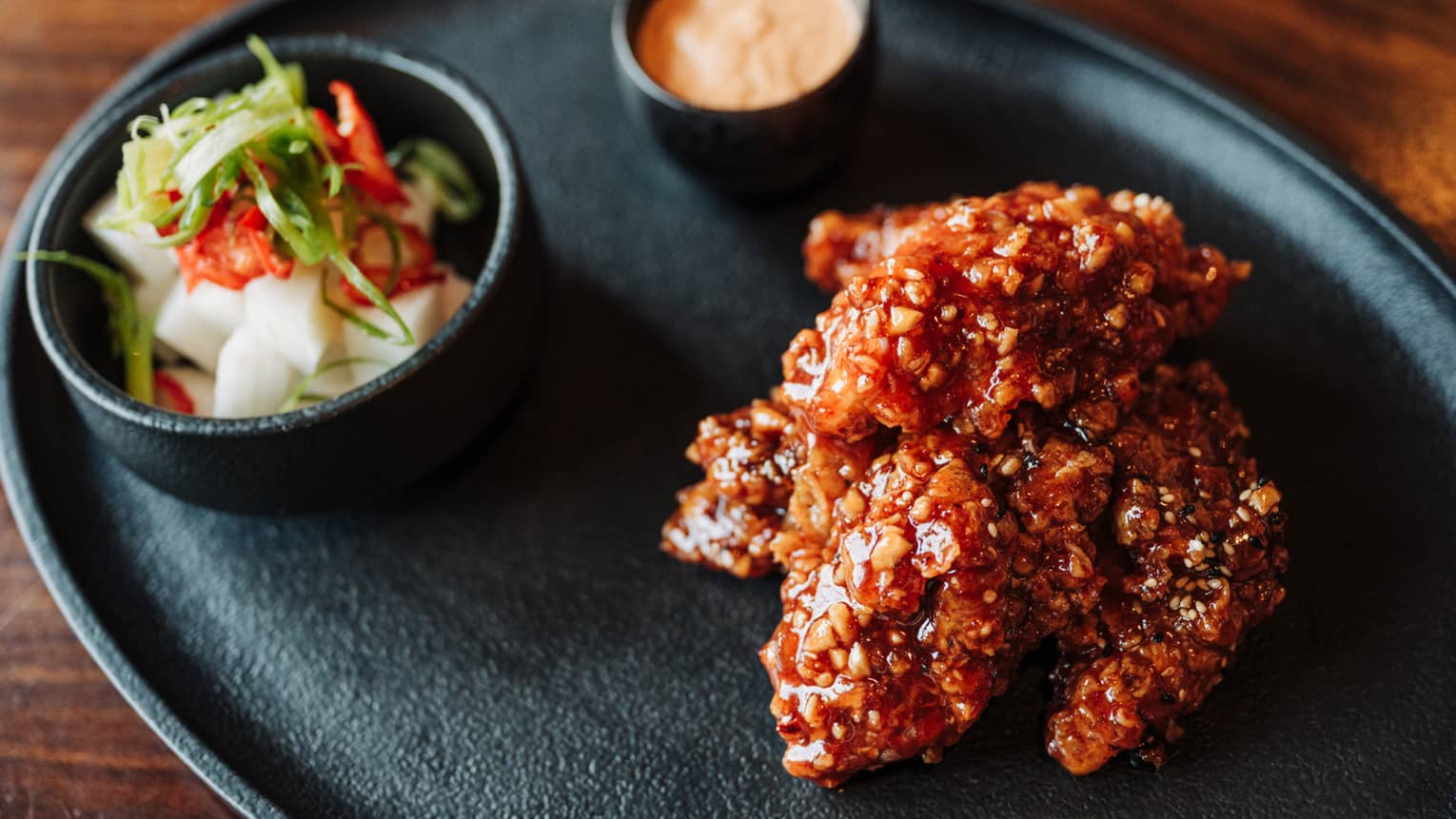 Korean barbecue plated on a black dish
