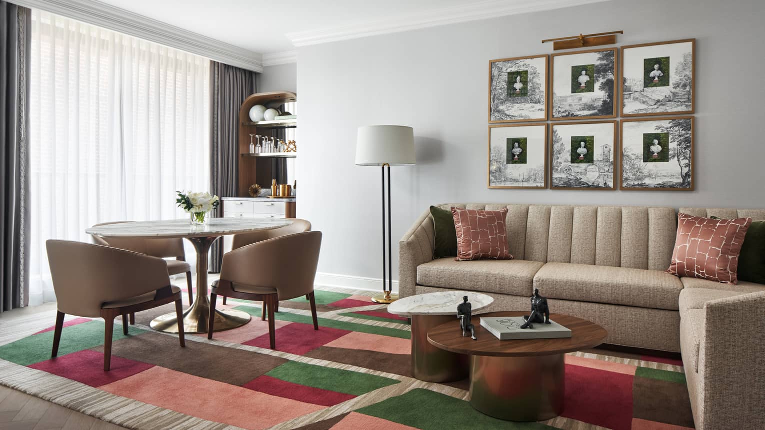 Capital Suite living room with sofa and round dining table with four chairs, at Four Seasons Hotel Washington, DC