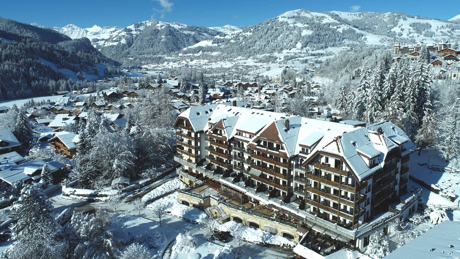 Aerial rendering of the residence building and surrounding snowy mountains