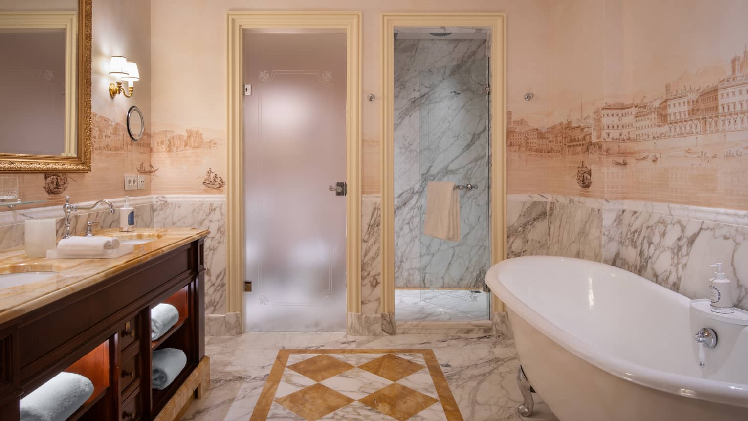 Hotel luxury bathroom with marble flooring and four-claw tub at Four Seasons Hotel Florence