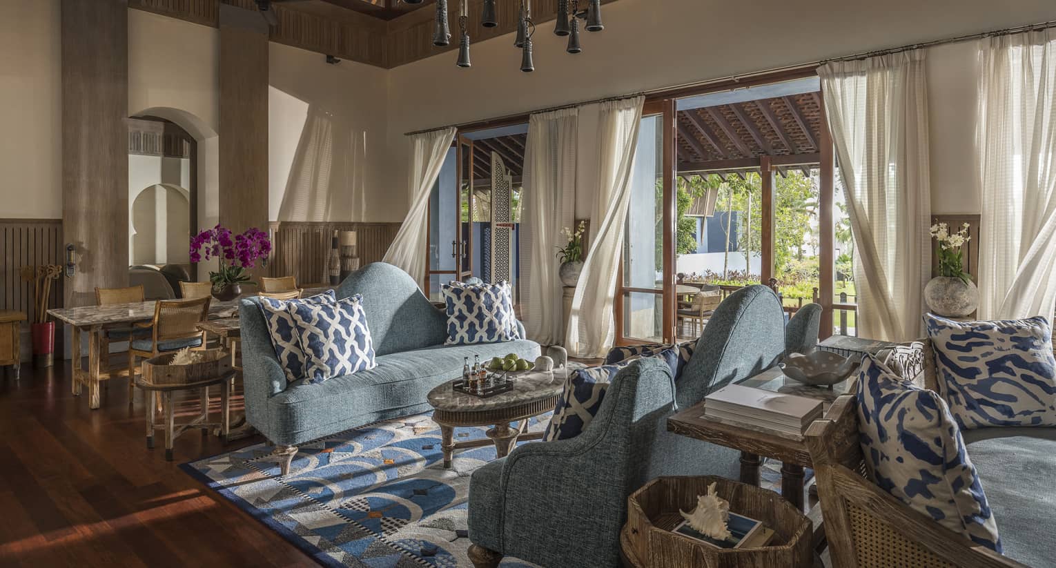 Three Bedroom Villa living room with two soft blue couches and airy views