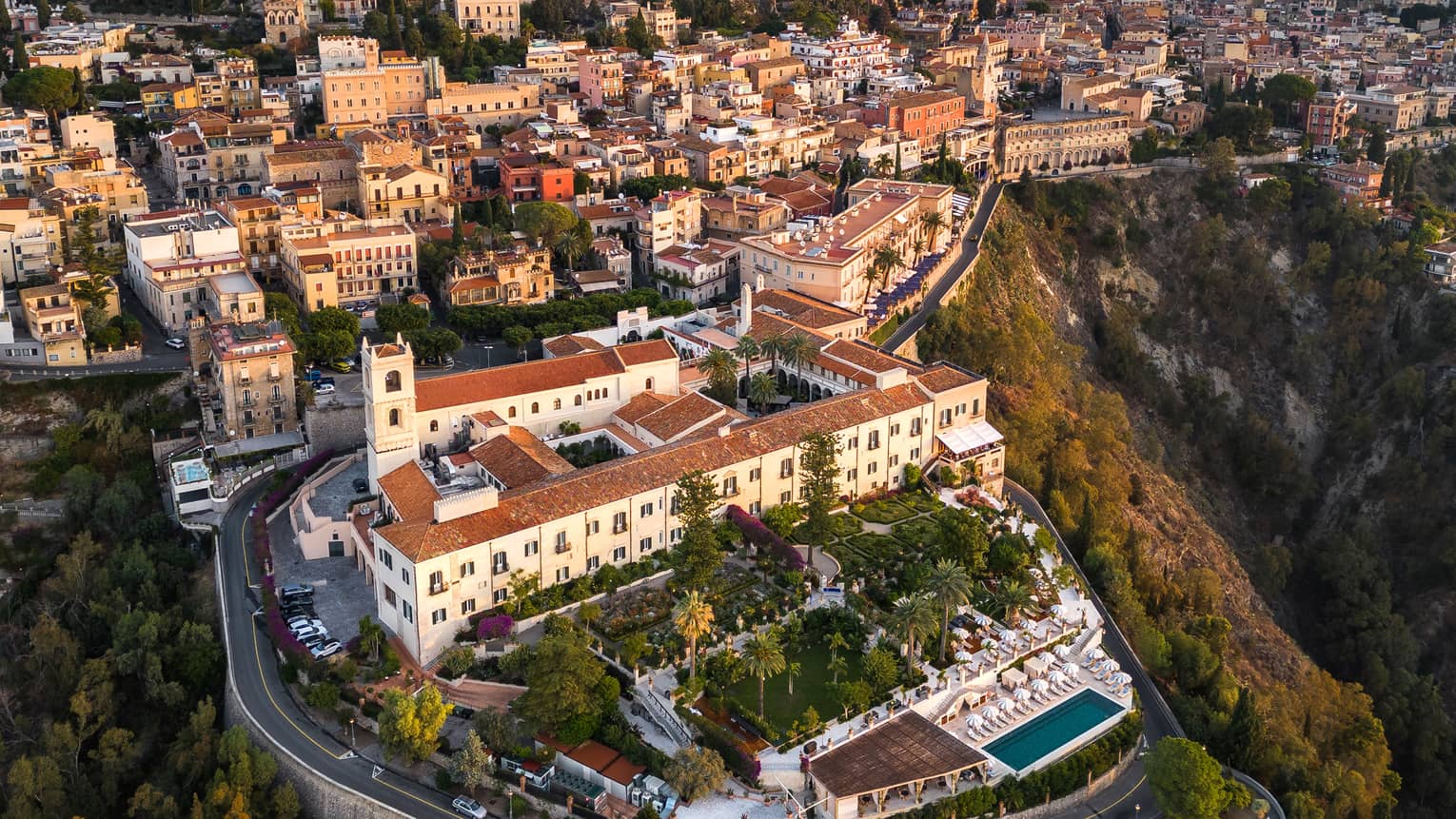 An Aerial view of a large property on a hill or cliffside.
