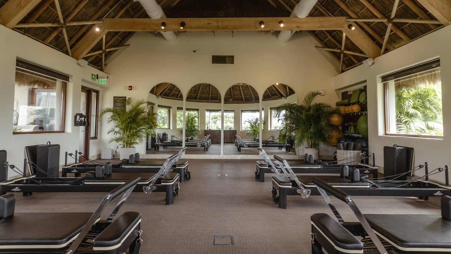 Fitness room with pilates equipment set up for a class