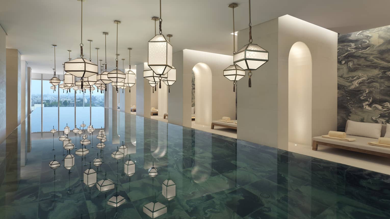 An empty foyer with white painted glass chandeliers reflections on an emerald green tile 