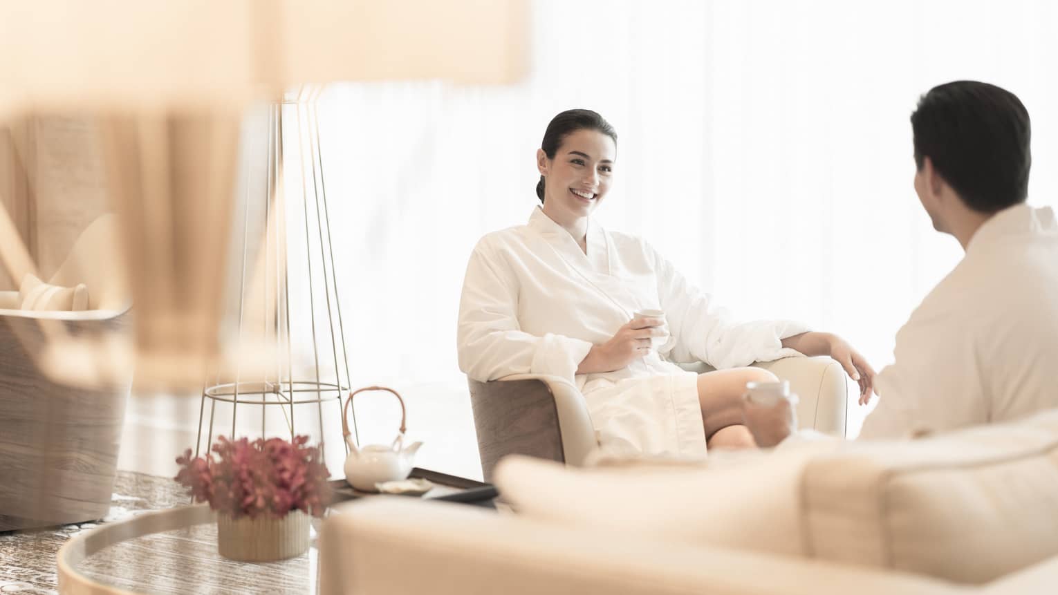 A couple relaxes in the spa seating area