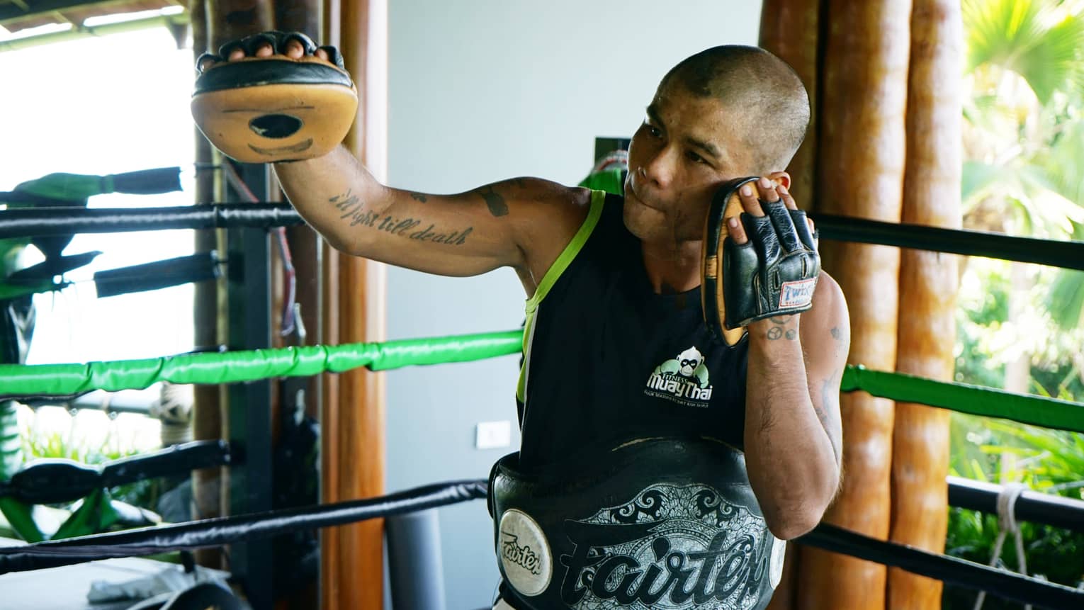 Resident Muay Thai expert, Anuphong Deesamer, leading a sparring session