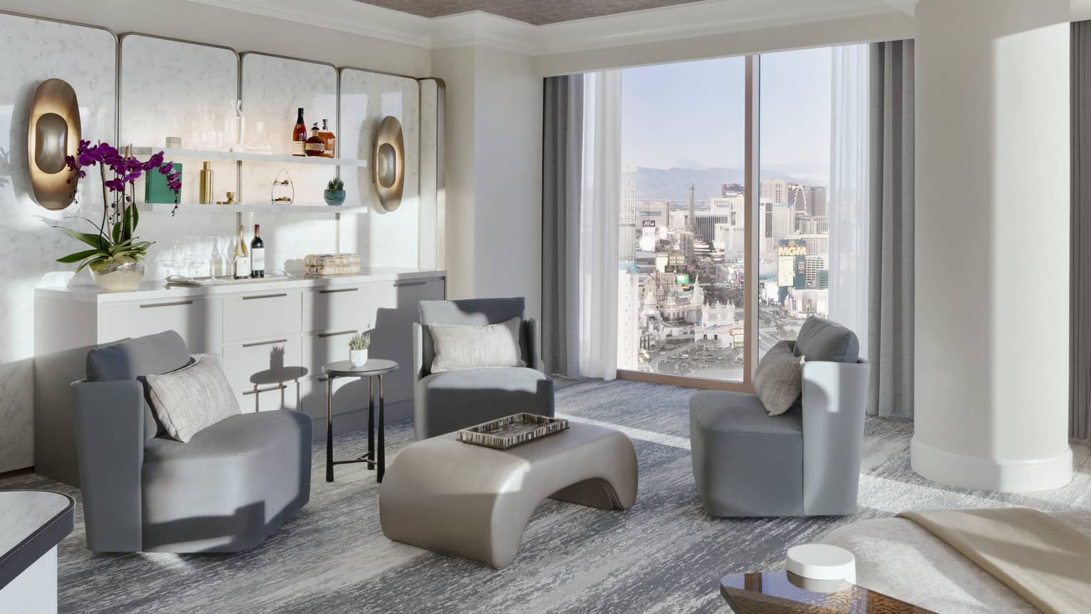Sitting area set next to a buffet and artwork in a luxury suite at Four Seasons Hotel Las Vegas