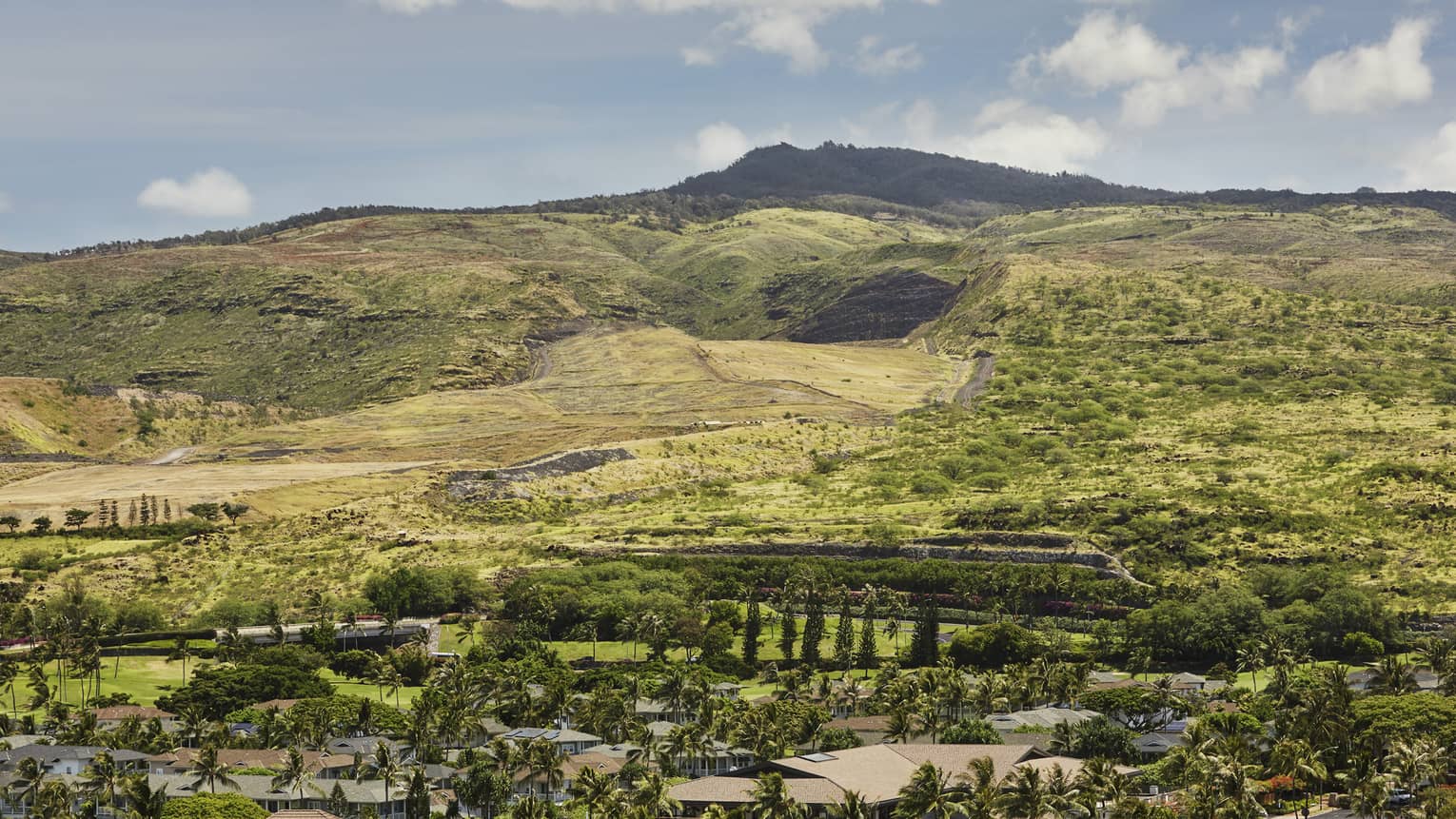 Sweeping green mountain views from one bedroom suite