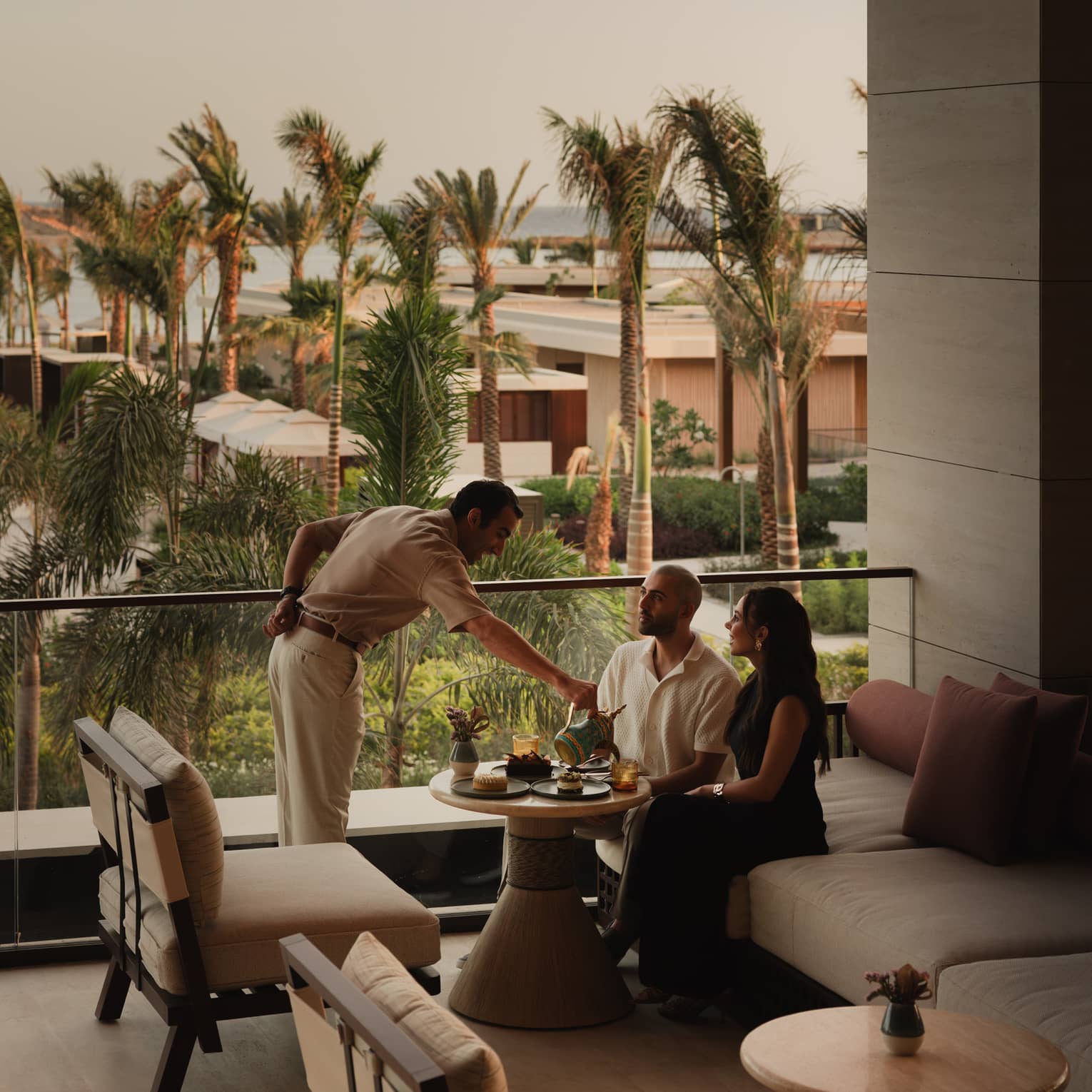 Two people are served at modern resort lounge
