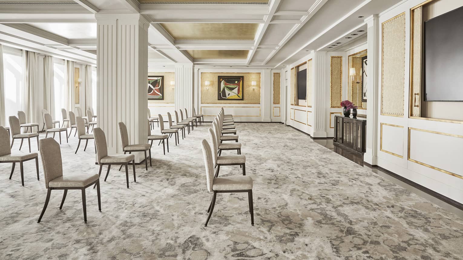 Meeting room with theatre set up, carpeting, white crown molding, white pillar in room