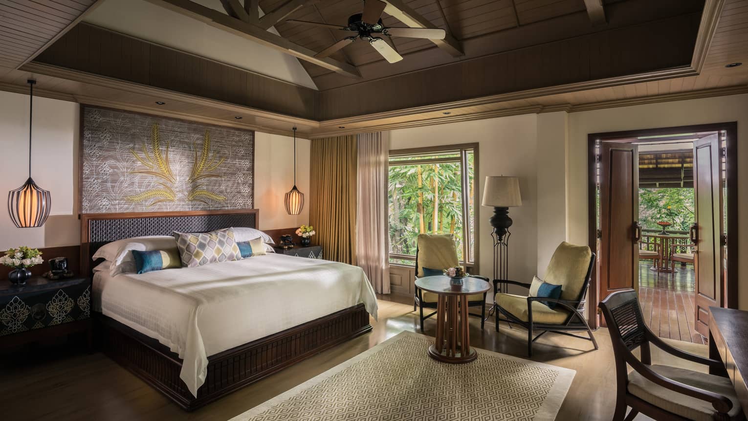 Rice Terrace Pavilion room bed, two yellow armchairs between window and door