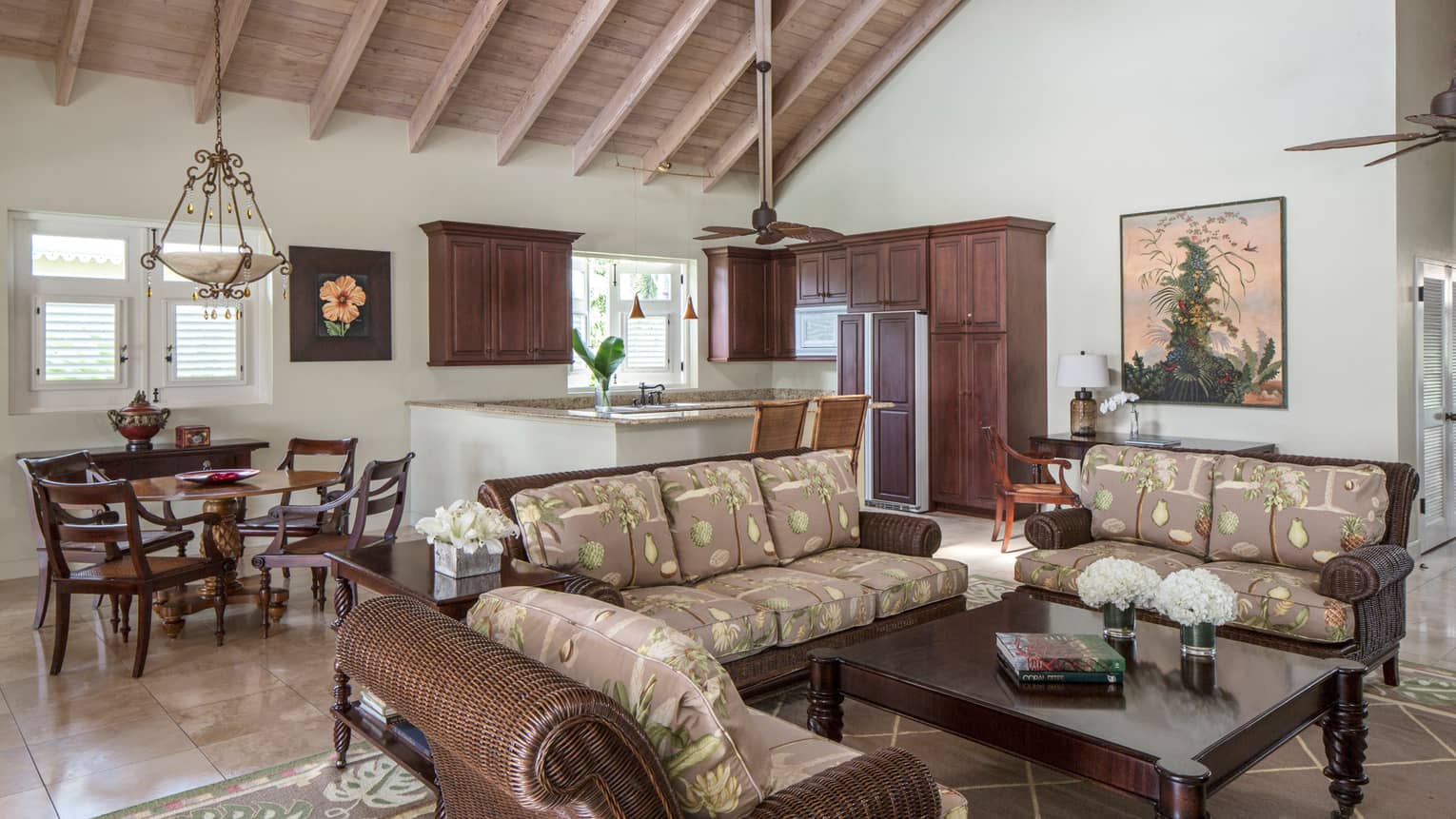 Palm Grove Residence rattan furniture, plush cushions, small dining table, kitchenette