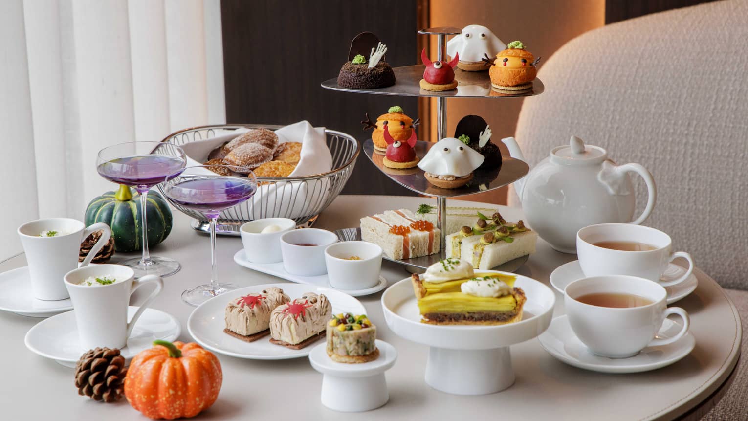Halloween-themed afternoon tea spread on a table