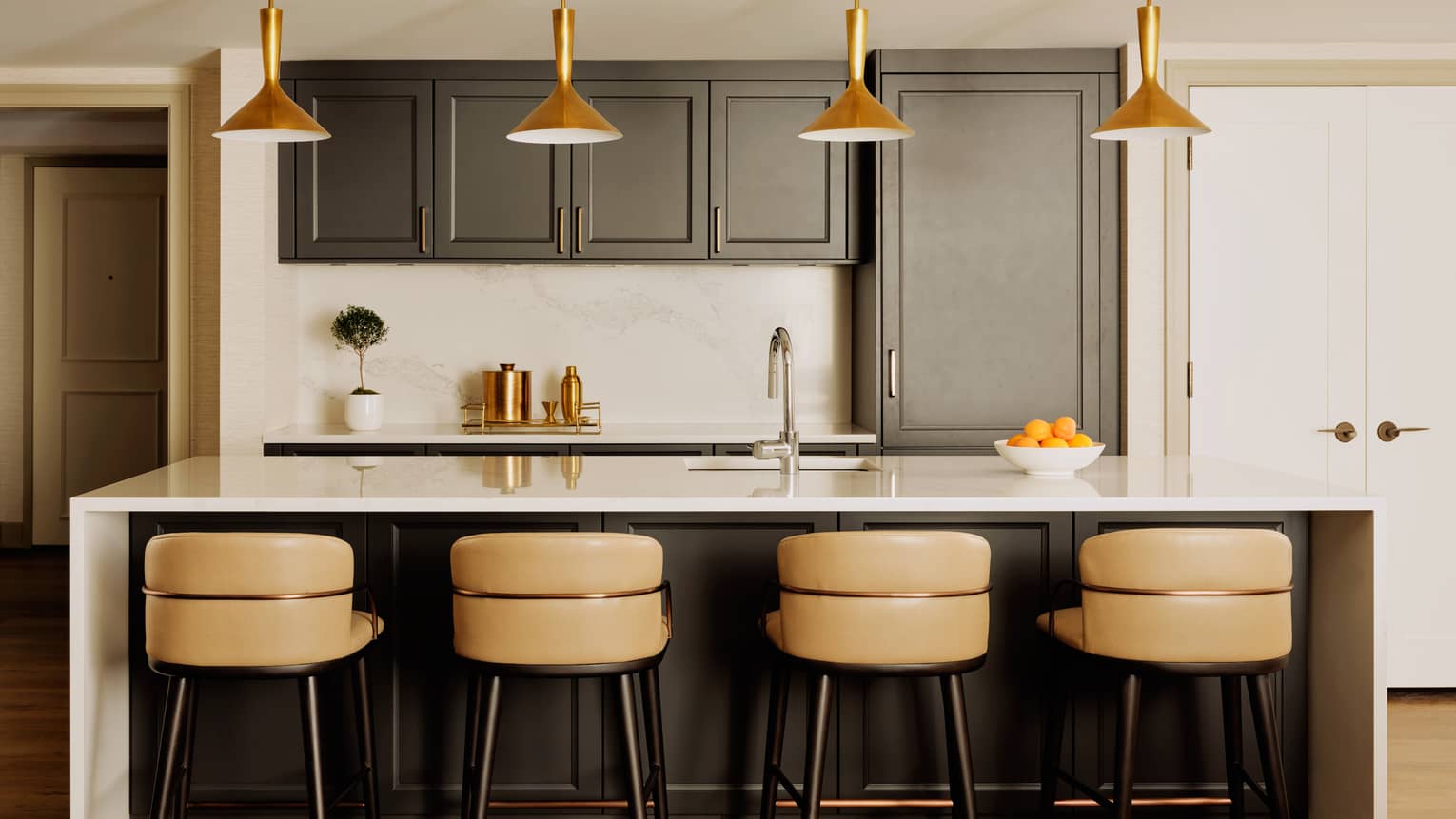 Contemporary kitchen with four counter seats at an island