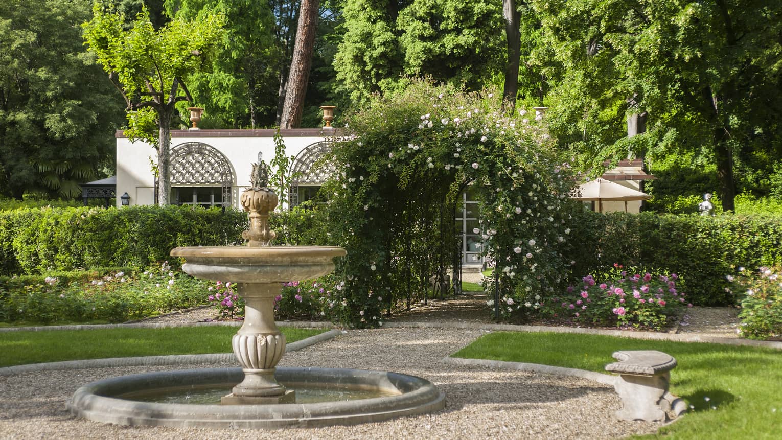 Stone fountain in sunny Garden Villa courtyard 