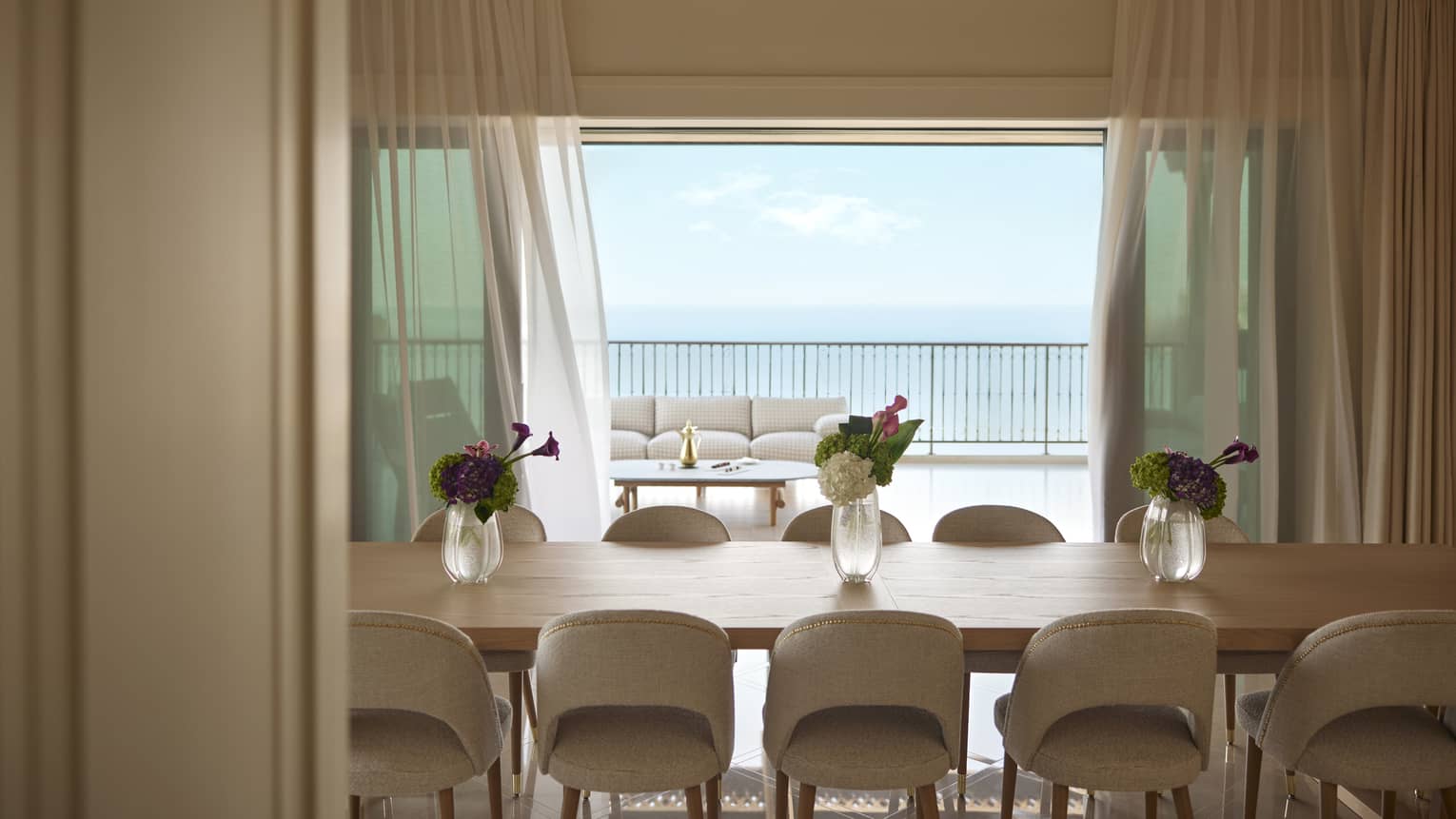 Luxury suite dining room with sea view and table with 10 chairs
