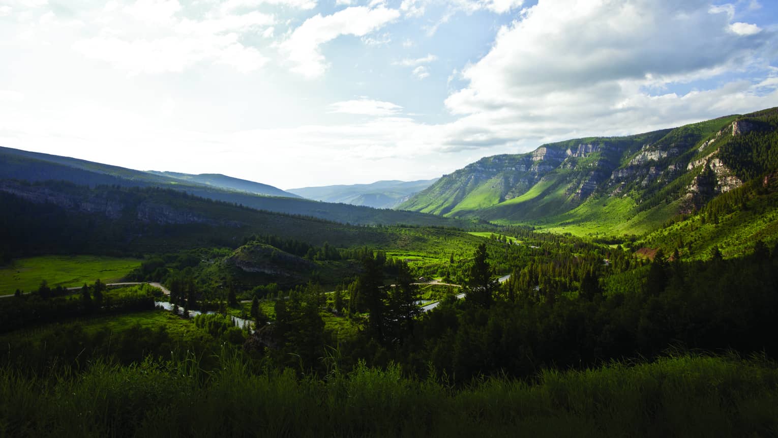 Aerial view of sweeping green mountain range