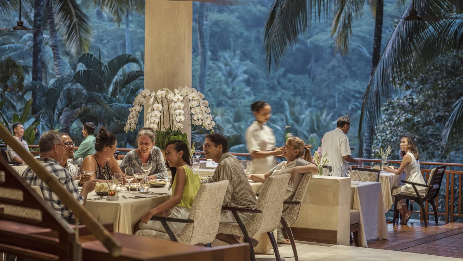 Ayung Terrace open air restaurant dining room surrounded by large palms