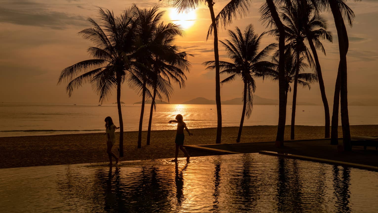 Sunrise Pool Villa sunset view off the pool and ocean