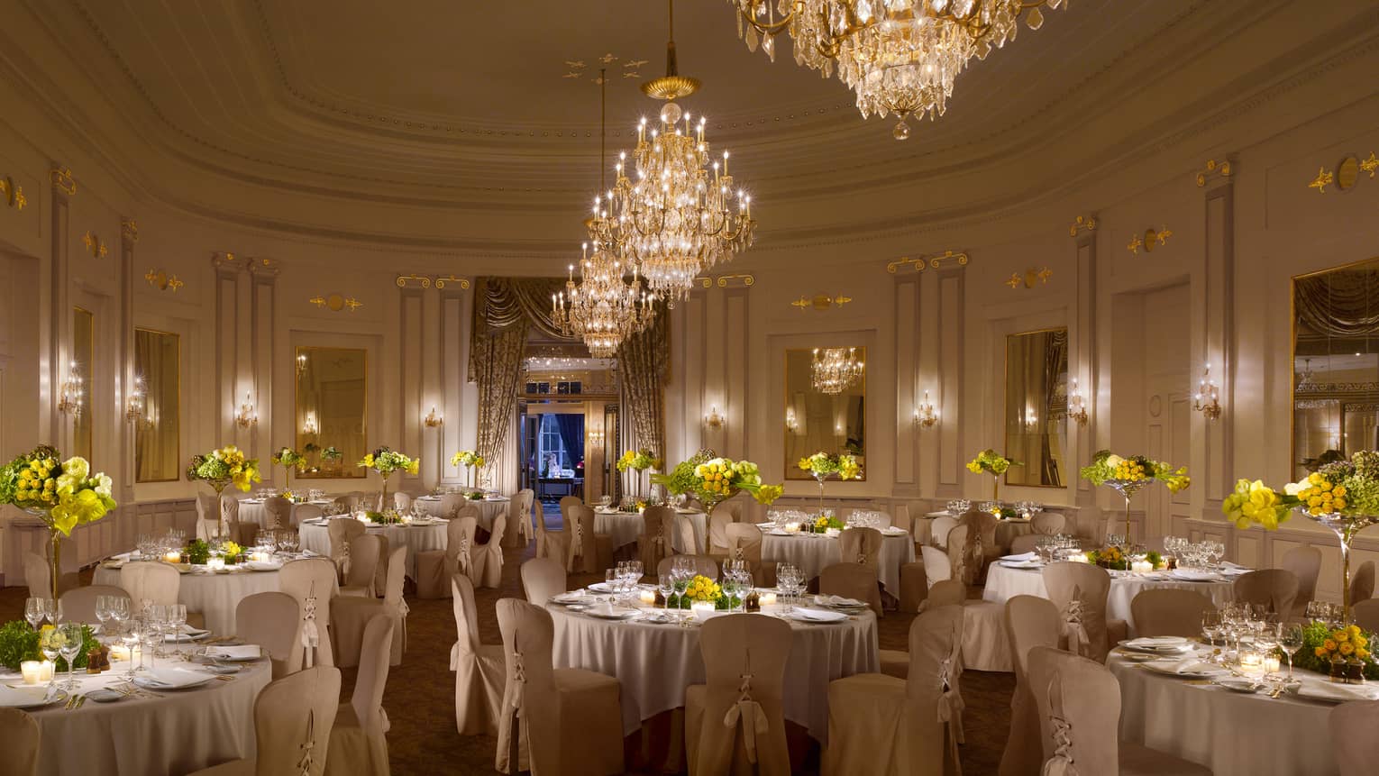 Salle des Nations elegant banquet set up under large crystal chandeliers 