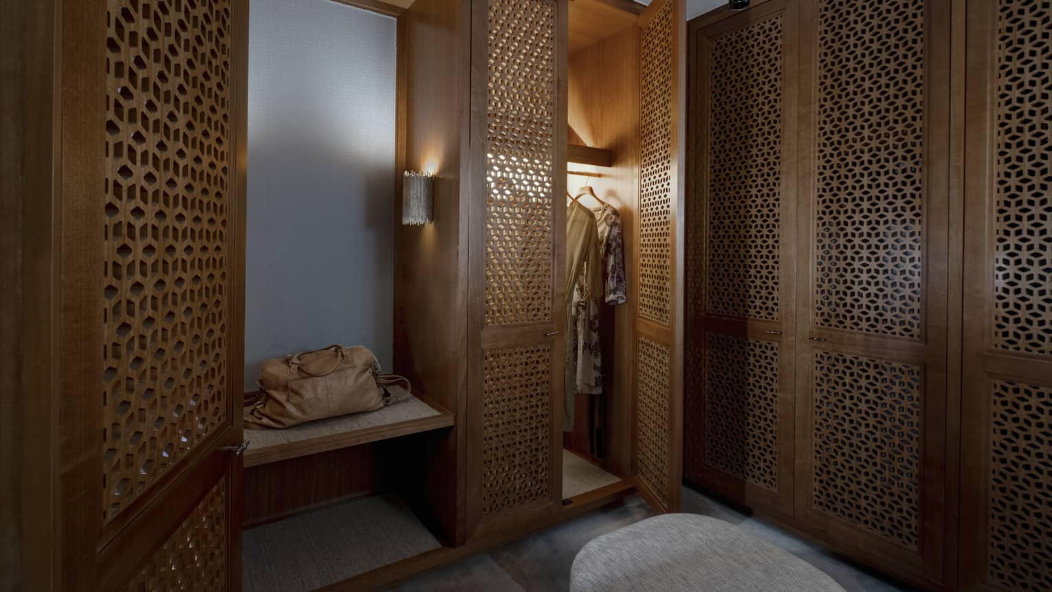 Walk-in closet with detailed wooden doors