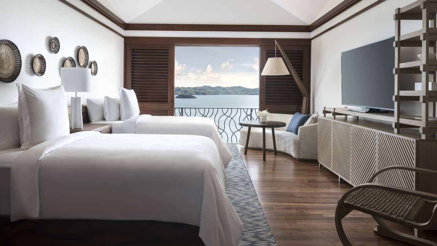 Two-Bedroom Residence Villa with Plunge Pool side view of twin beds in front of open wood shutters to patio