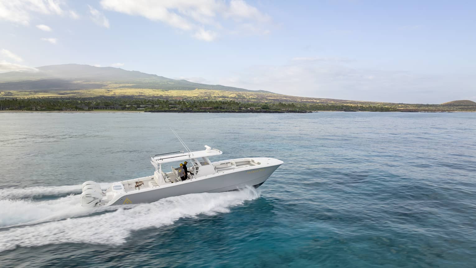 Boat on the water along Hawaii Island coast