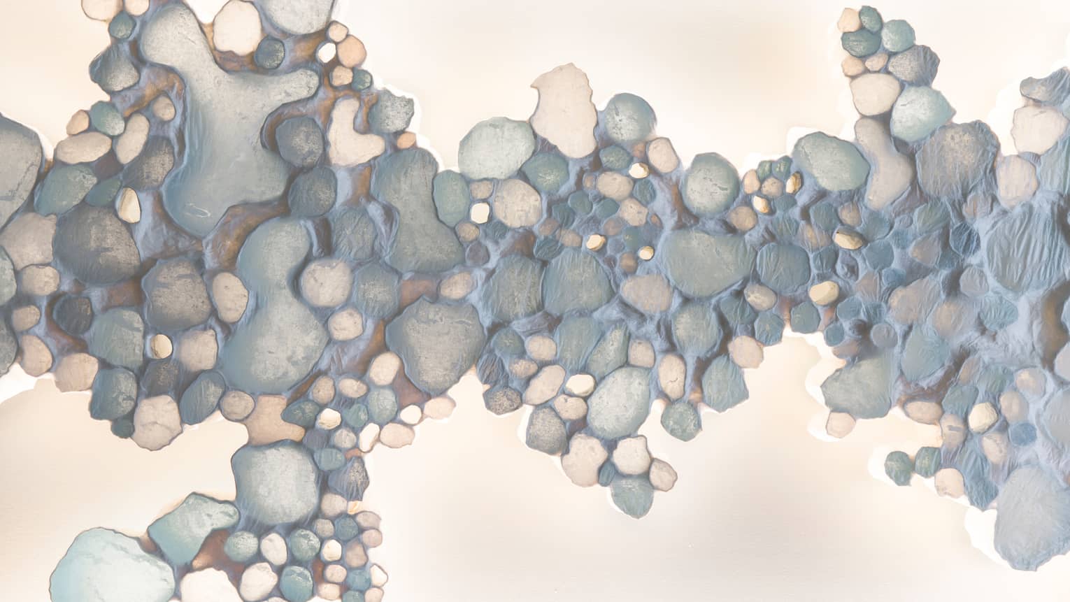 Painting of pebbles in ocean hues at Driftwood Spa