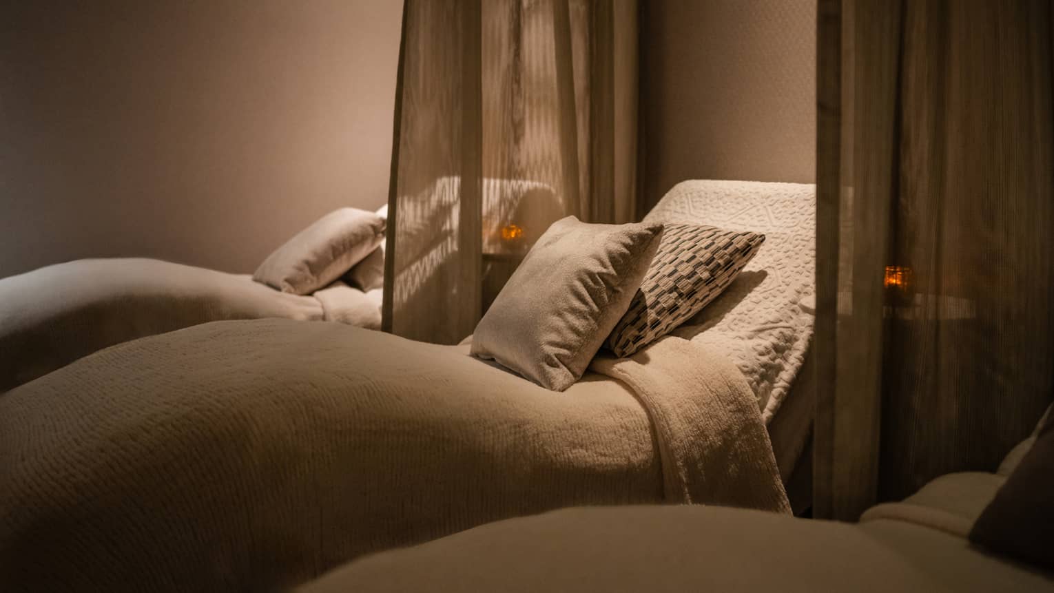Spa beds with curtains on the side of each bed