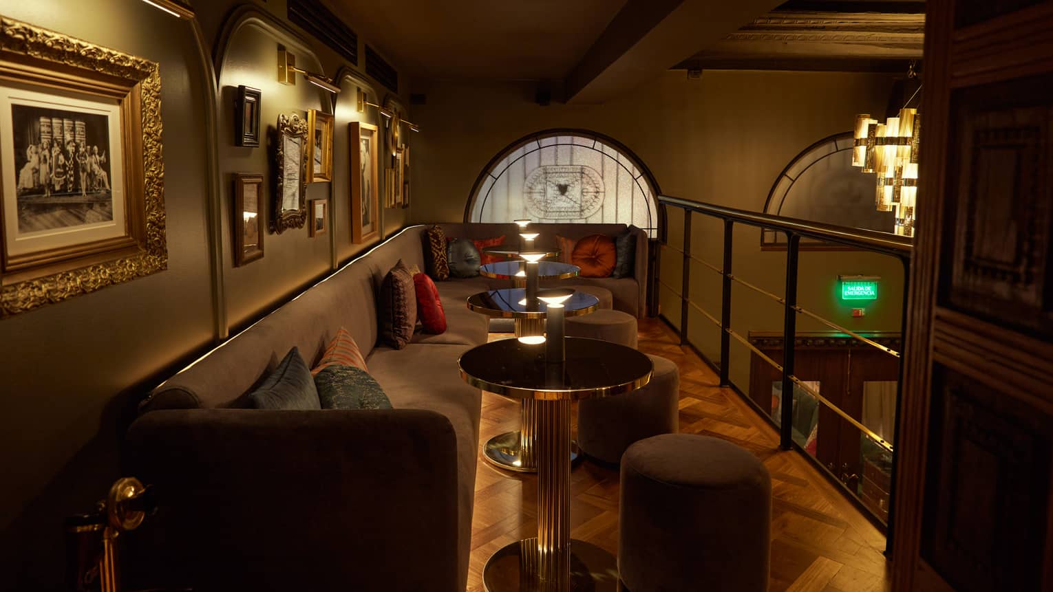 A dimly lit lounge area with art on the wall.