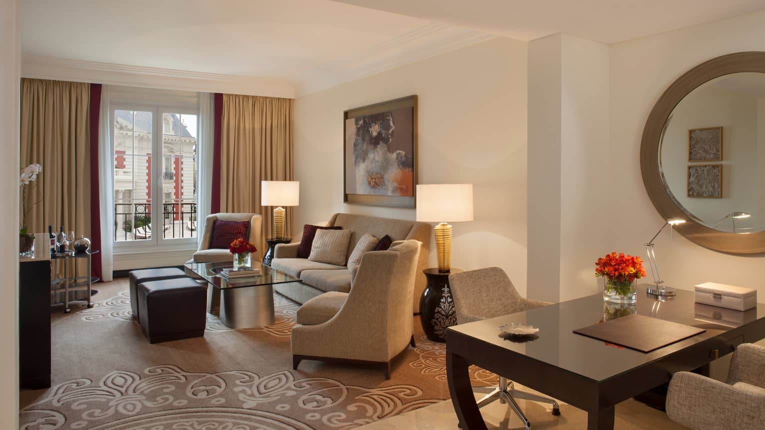 Mansion-View One Bedroom Suite living room with beige sofa and chairs, desk with two chairs