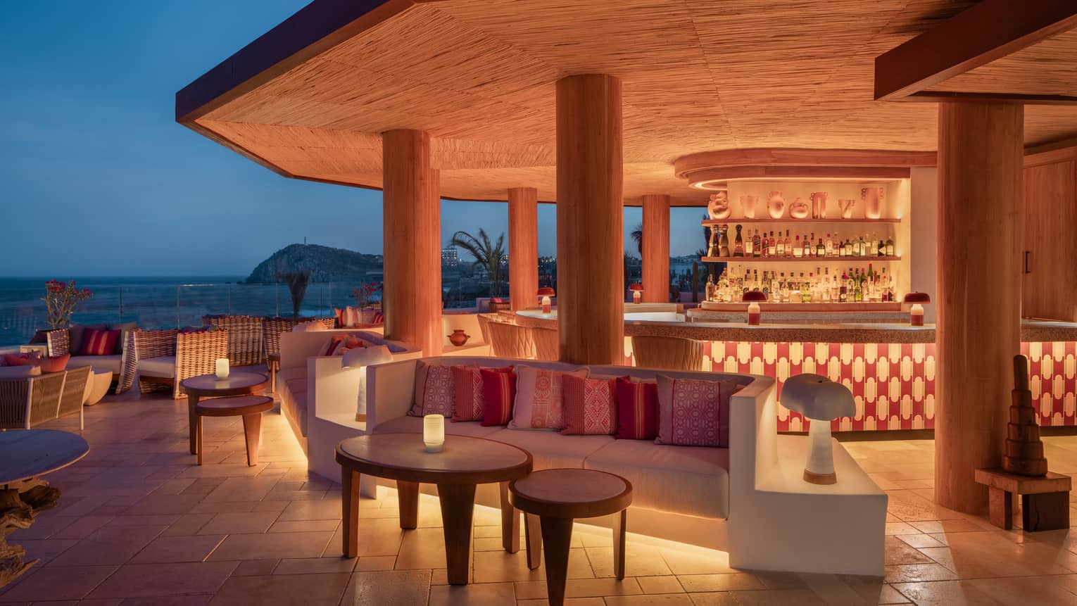 Illuminated ocean view bar at night at Cabo San Lucas
