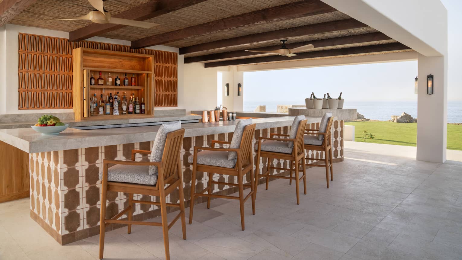 Outdoor, covered Brisol Pool Bar with ocean view at Four Seasons Cabo San Lucas at Cabo Del Sol