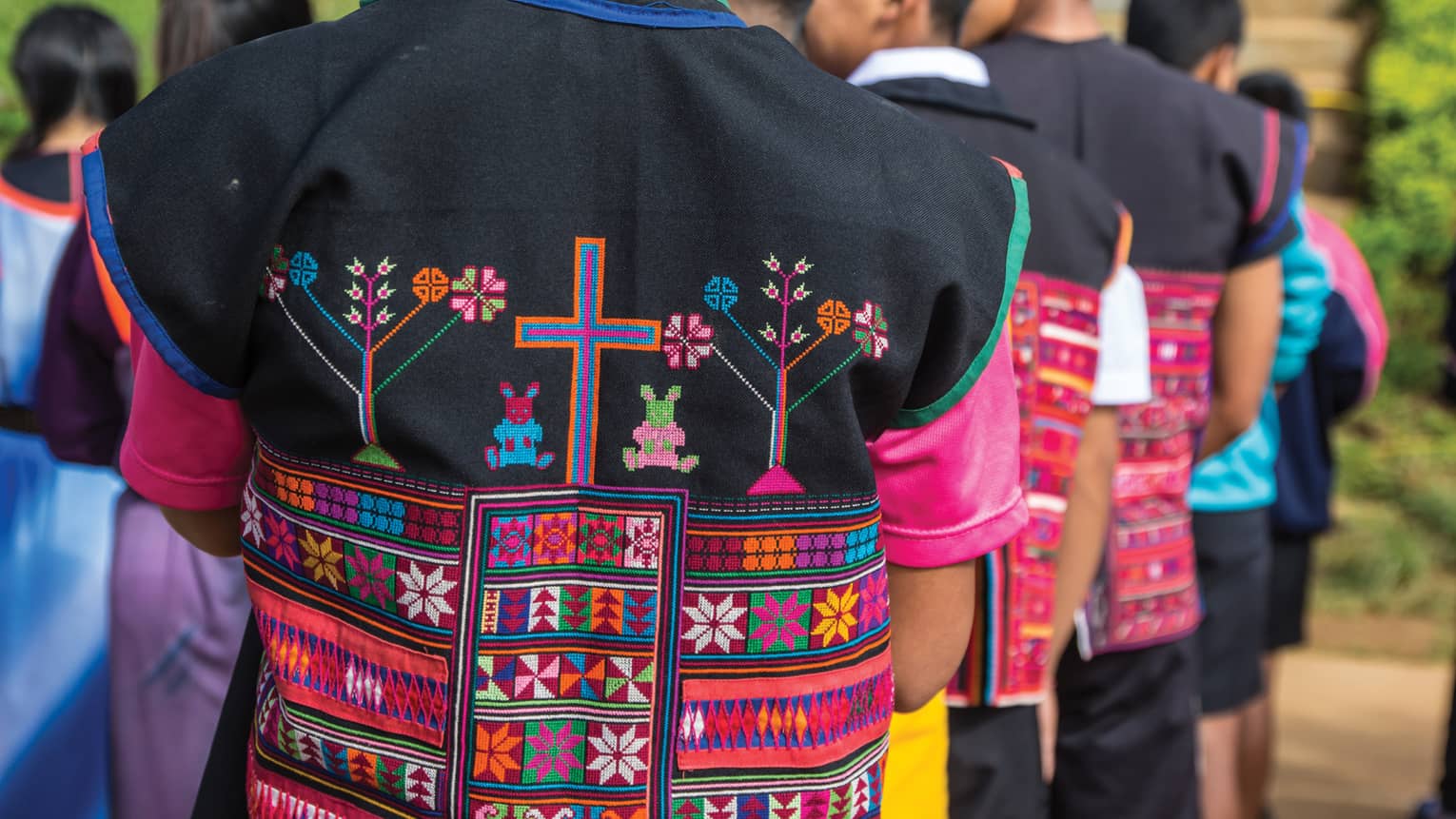Close-up of colourful textiles on clothing made by hill tribes