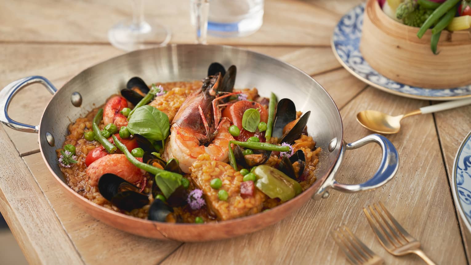 Seafood and vegetable dish served in a silver dish