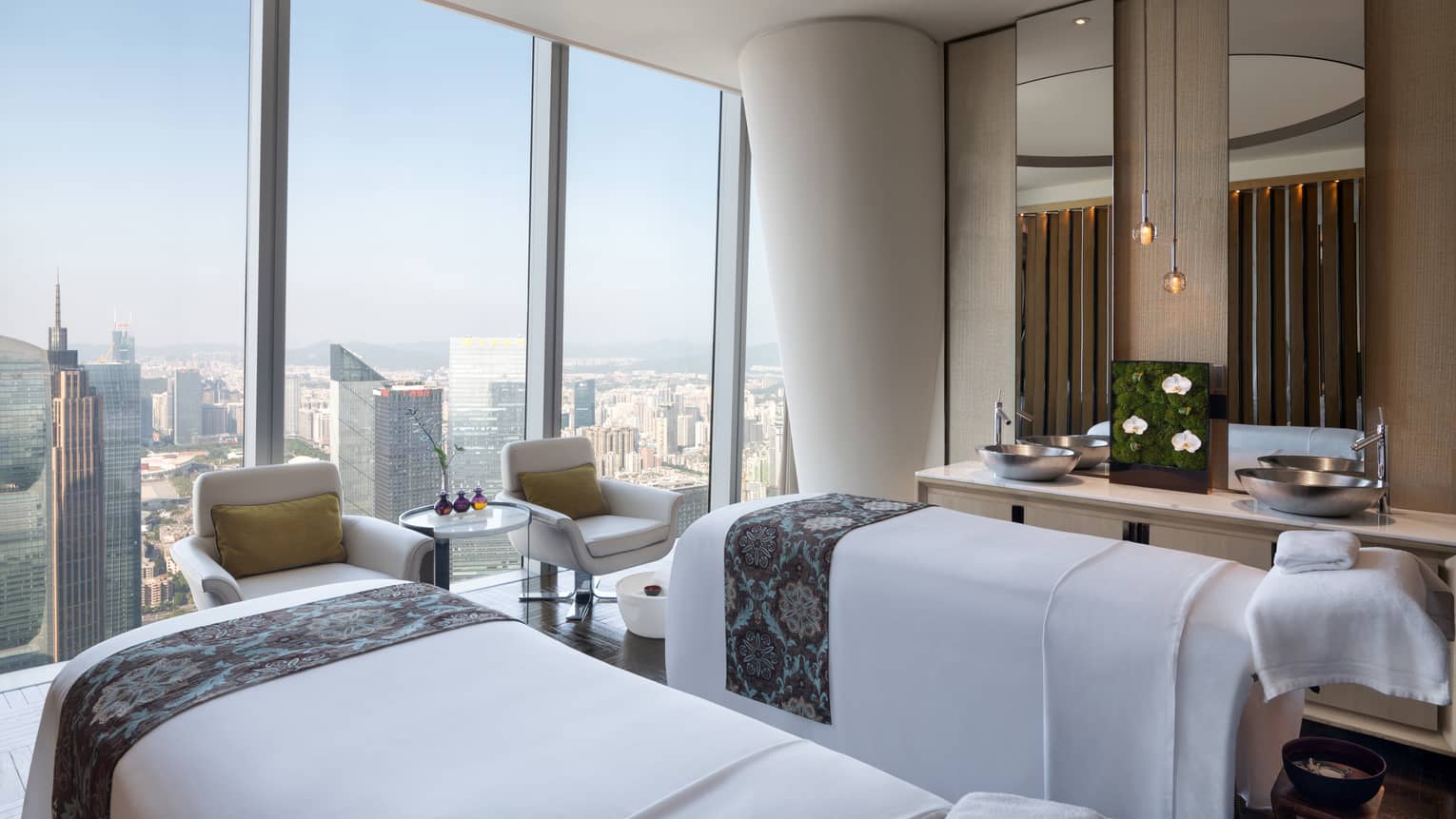 Couples? treatment beds at the Spa with floor-to-ceiling windows and natural light