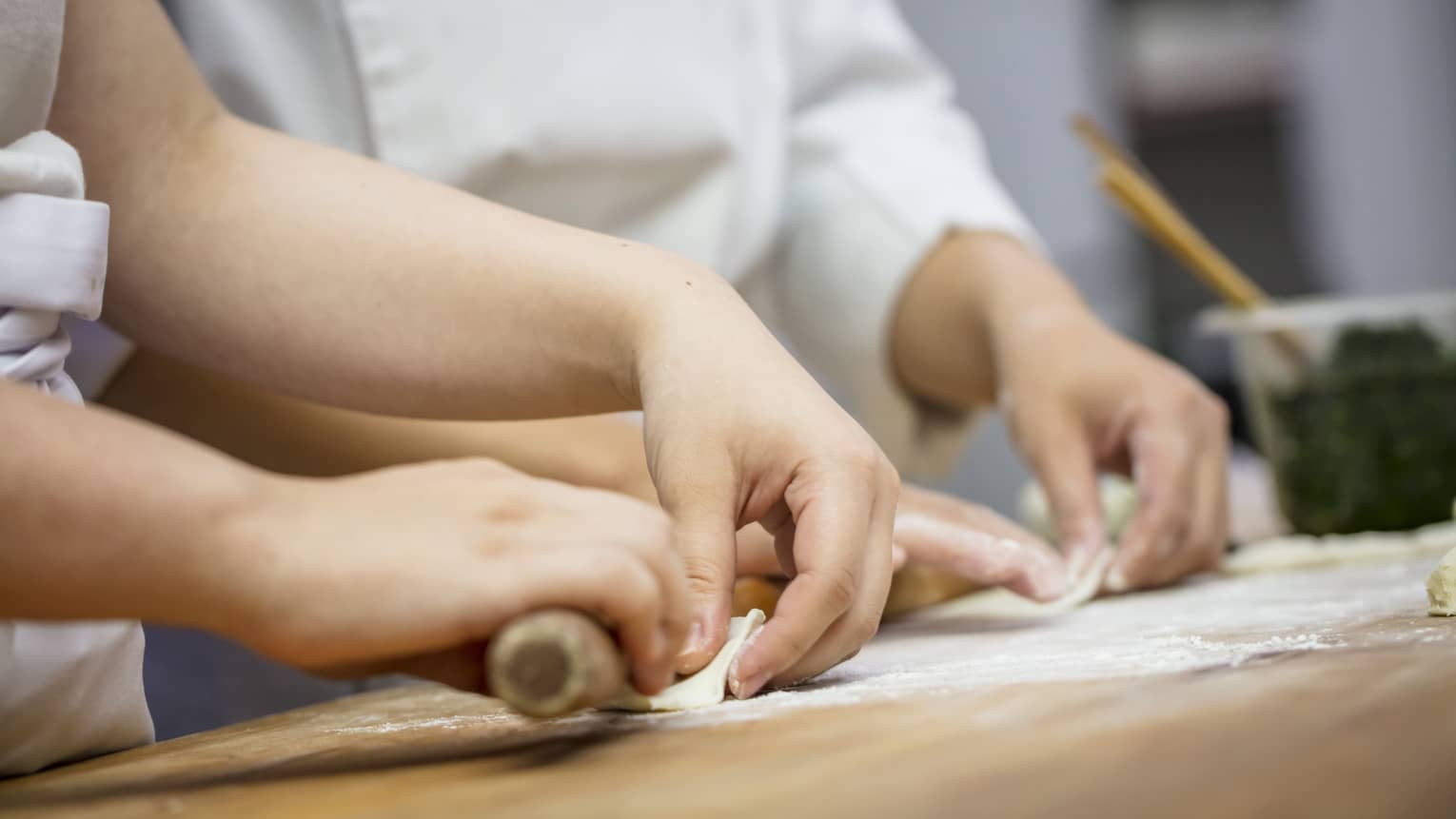View of hands rolling dumplings at Jin Sha Dim Sum class